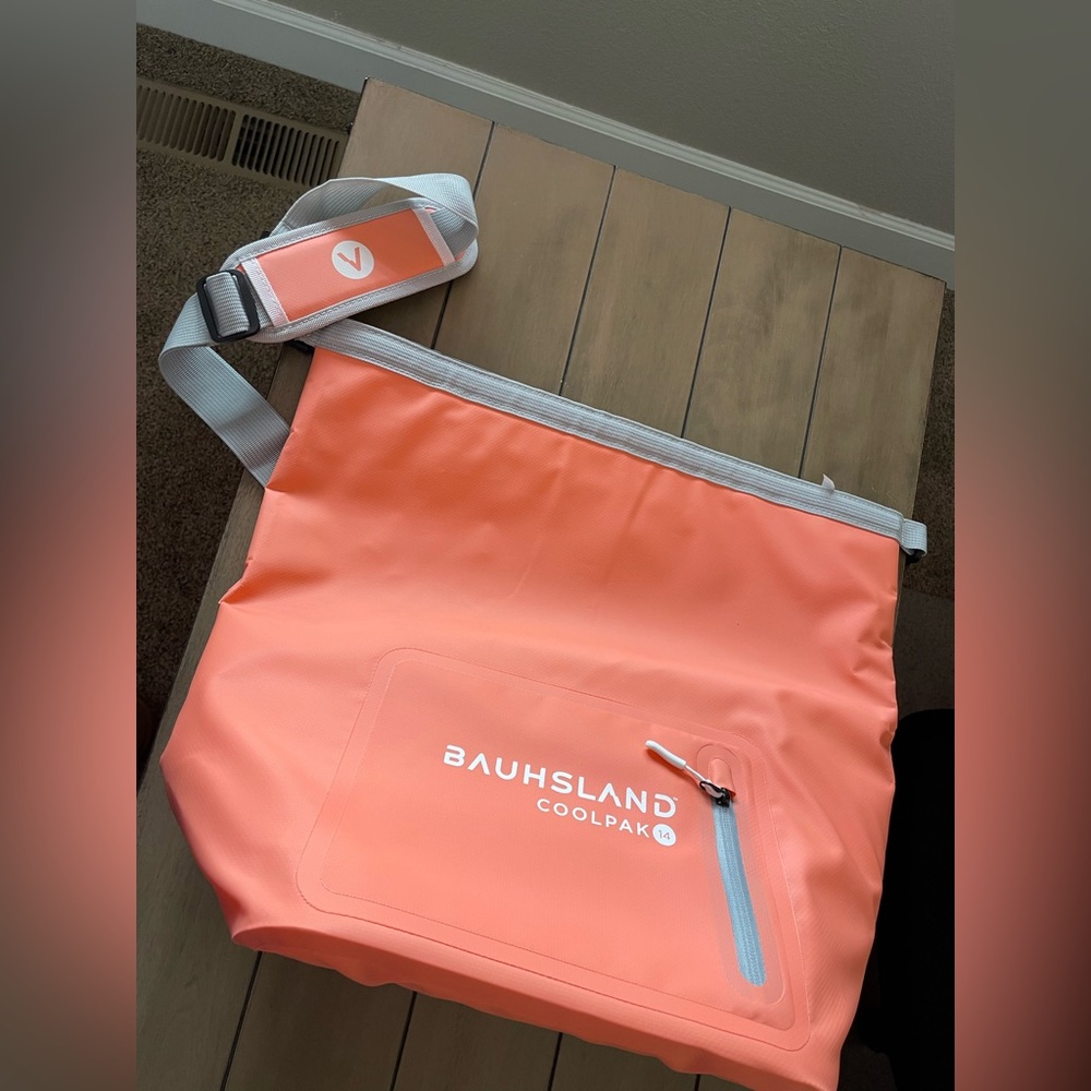 Insulated, water proof, leak proof cooler! Coral colored with carrying strap.
